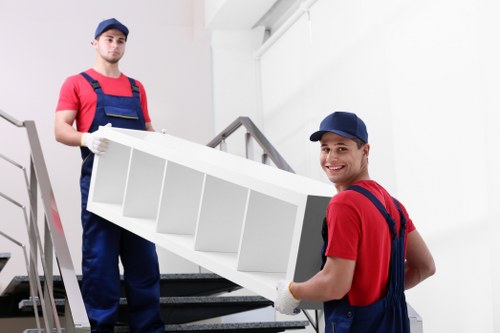 Professional movers loading a van in Knightsbridge street