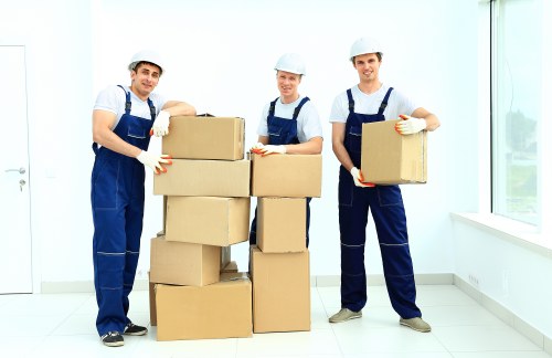 Movers handling furniture carefully during a same day move in Knightsbridge